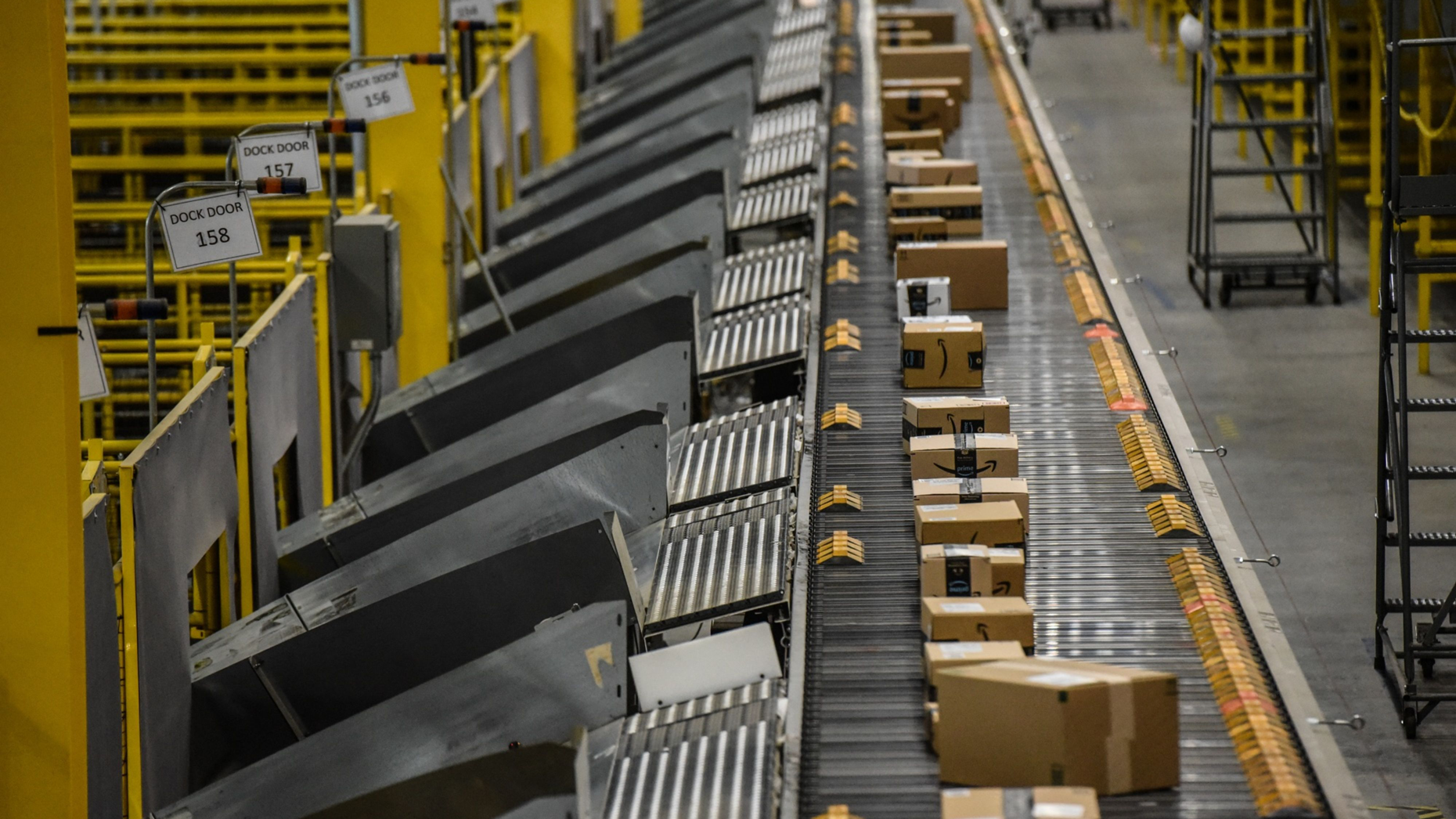 Packages move along a conveyor belt at an Amazon Fulfillment center in Robbinsville, N.J. Photo by Bloomberg.