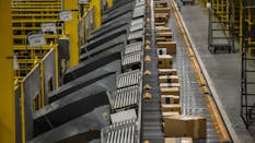 Packages move along a conveyor belt at an Amazon Fulfillment center in Robbinsville, N.J. Photo by Bloomberg.