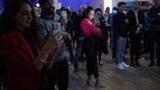 Tarlon Khoubyari (center) takes a photo of an onstage presentation at “Not a Boring Tech Party” on Thursday in the Mission District. It was a launch party for events company AfterWork, which is creating AI tools for party planners. Photograph by Laura Morton for The Information