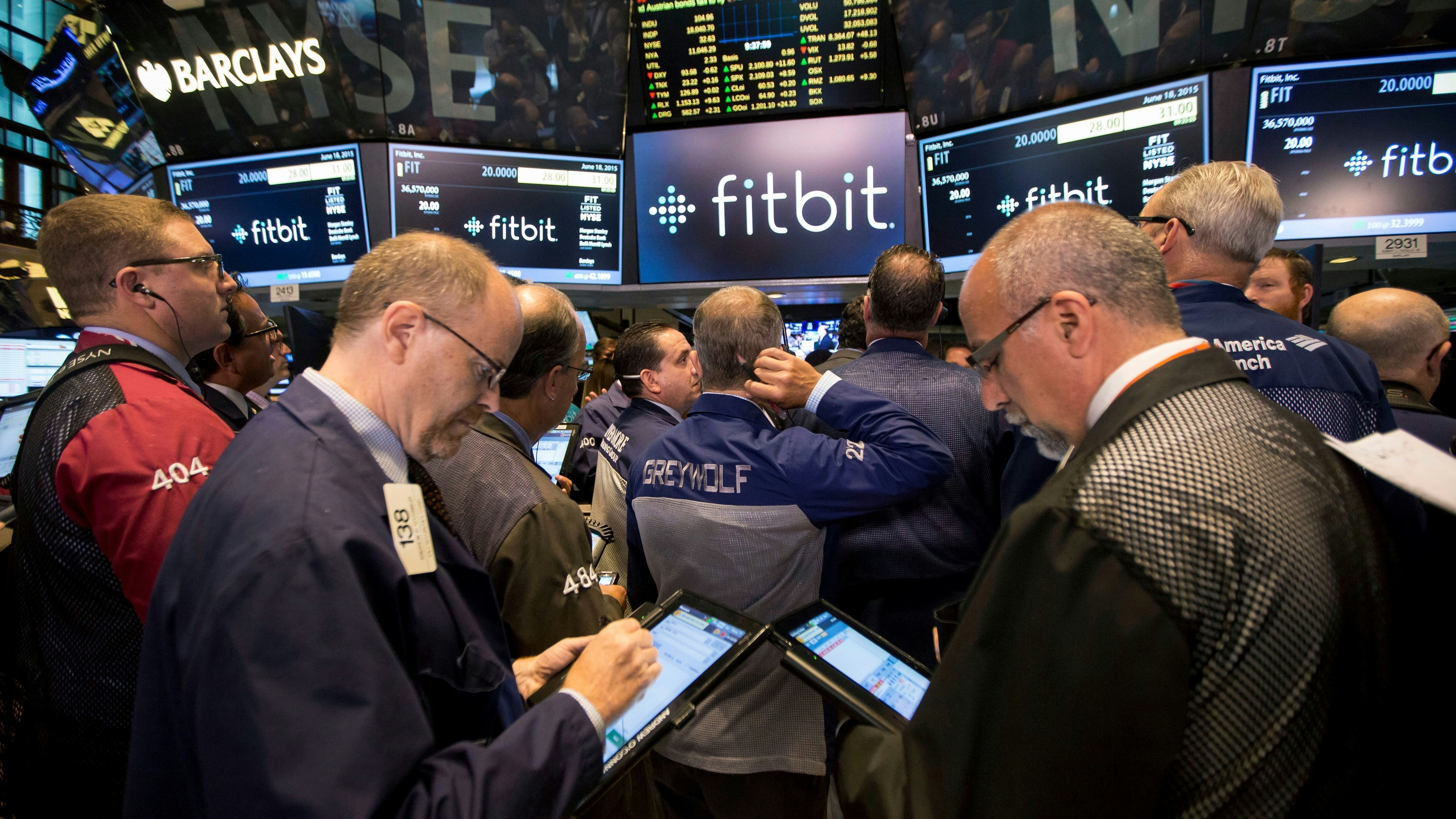 Traders on the floor of the NYSE on the day Fitbit went public. Photo by Bloomberg.