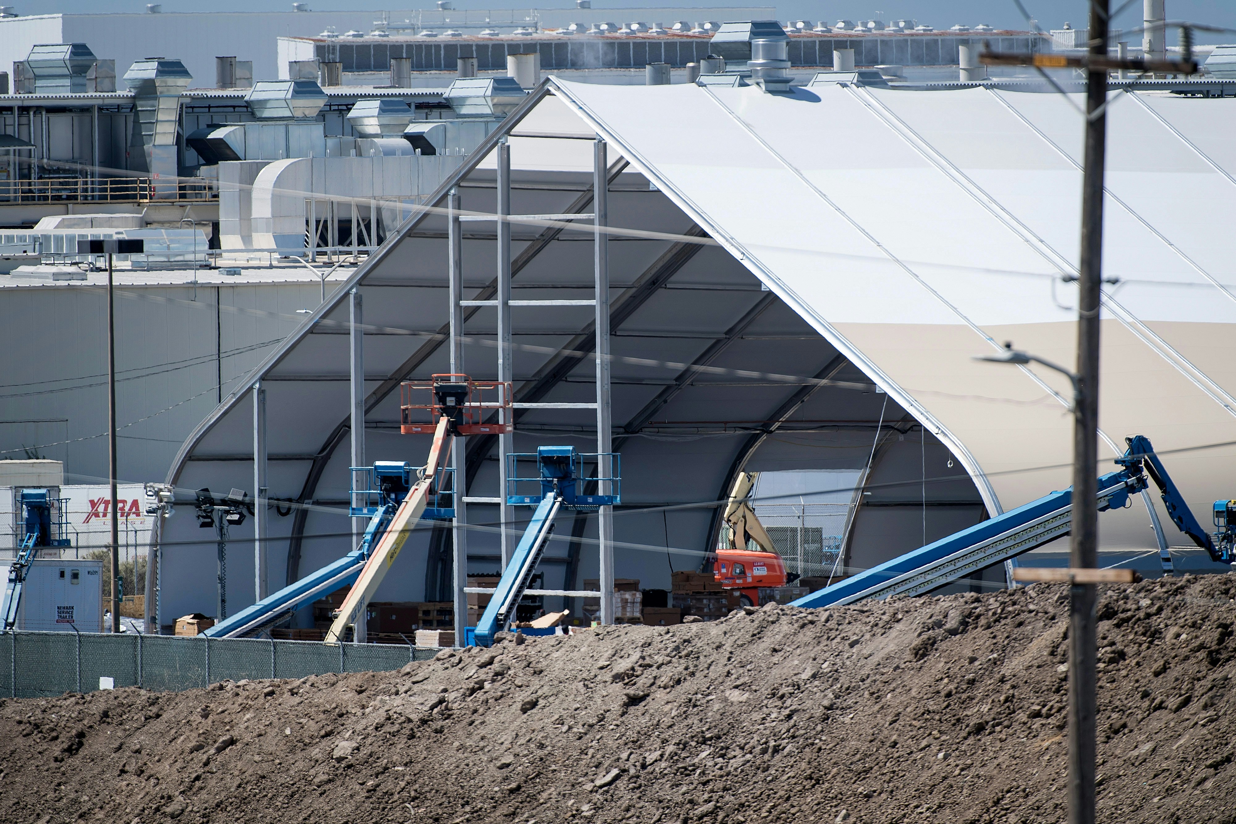 Amid "production hell," Tesla built a gigantic tent outside its Fremont, Calif. headquarters for Model 3 manufacturing overflow. Photo: David Paul Morris/Bloomberg/Getty
