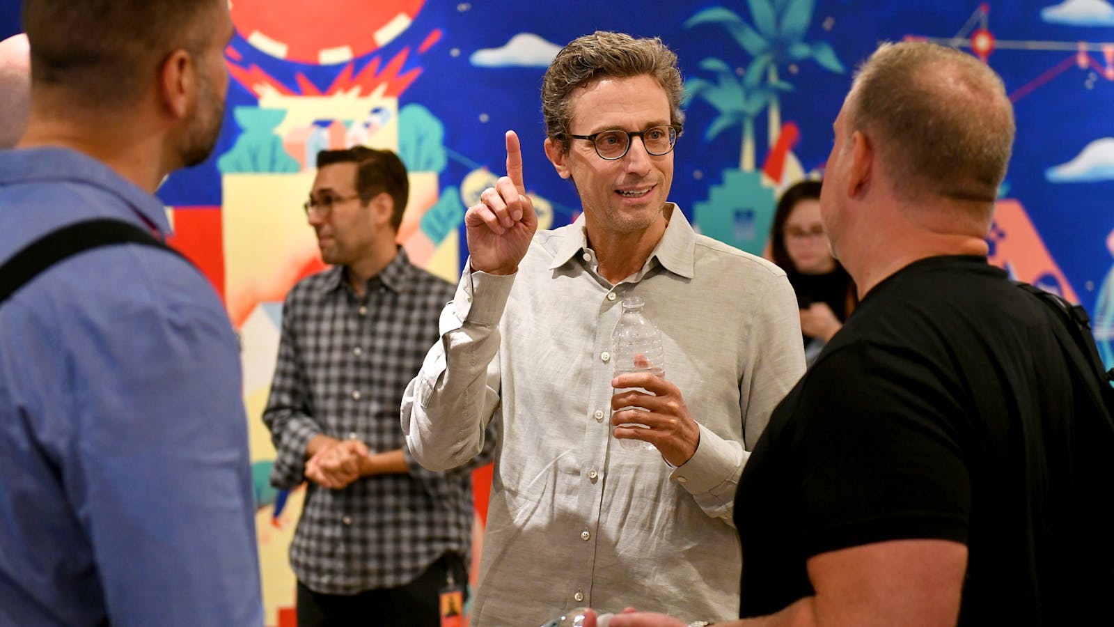 BuzzFeed CEO Jonah Peretti speaks with Justin Killion, former president of Complex Networks, and BuzzFeed's former COO Christian Baesler. Photo by Getty
