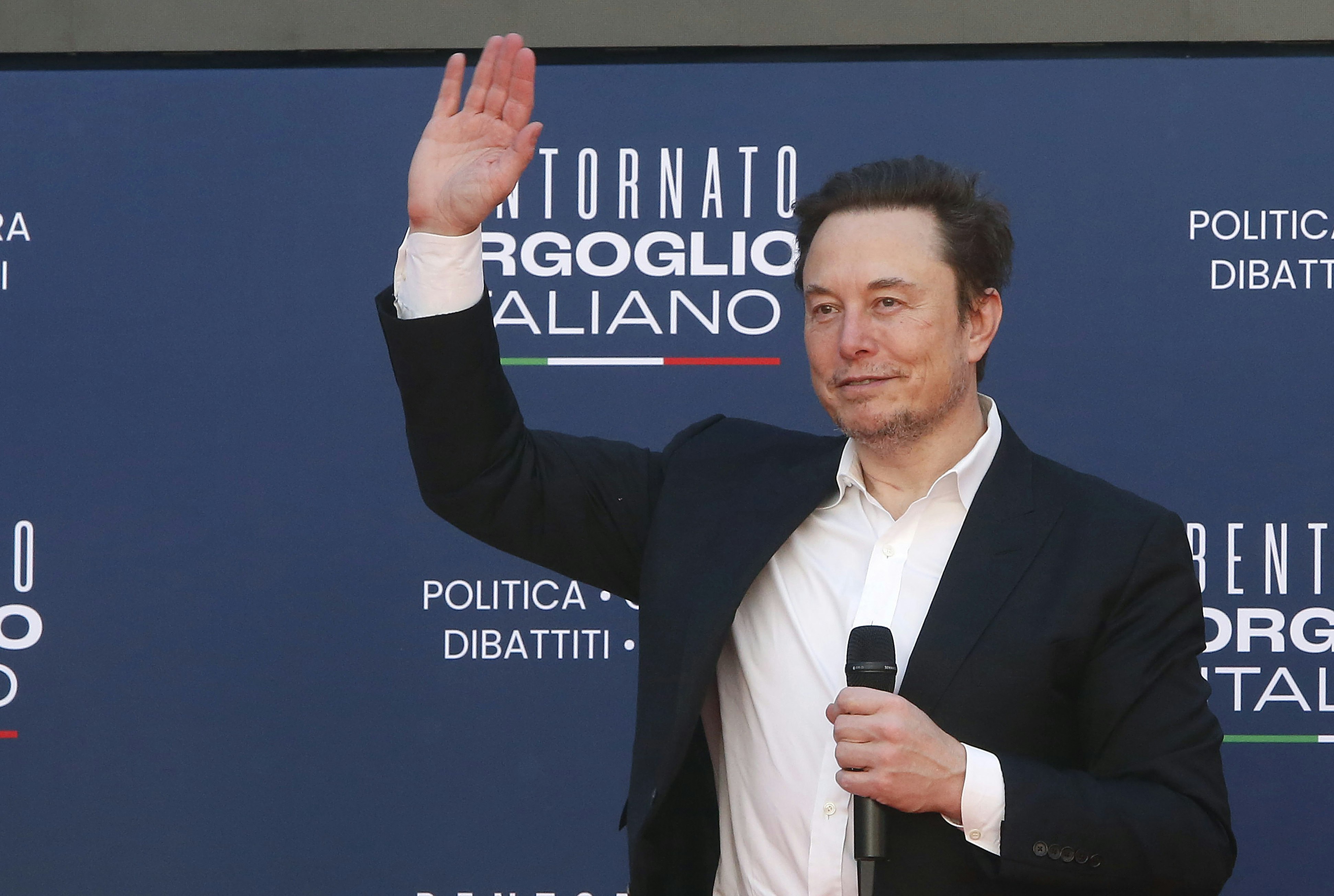 Musk appears Dec. 16 at a gathering of Italy's right-wing party Brothers of Italy. Photo: Marco Ravagli/Future Publishing/Getty
