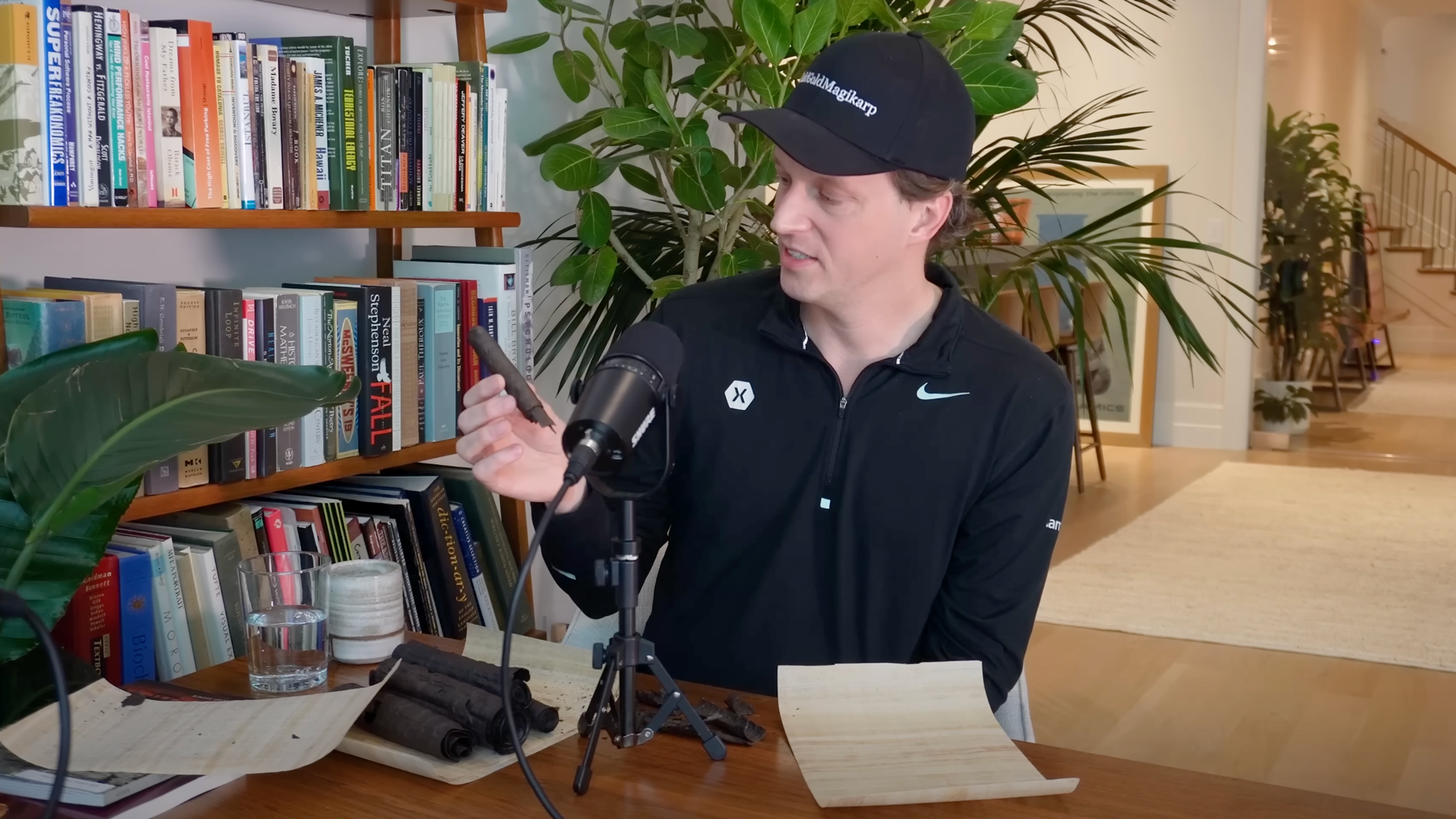 Nat Friedman holding one of the burnt scrolls from Vesuvius he set out to decipher. Photo via YouTube/Dwarkesh Patel.