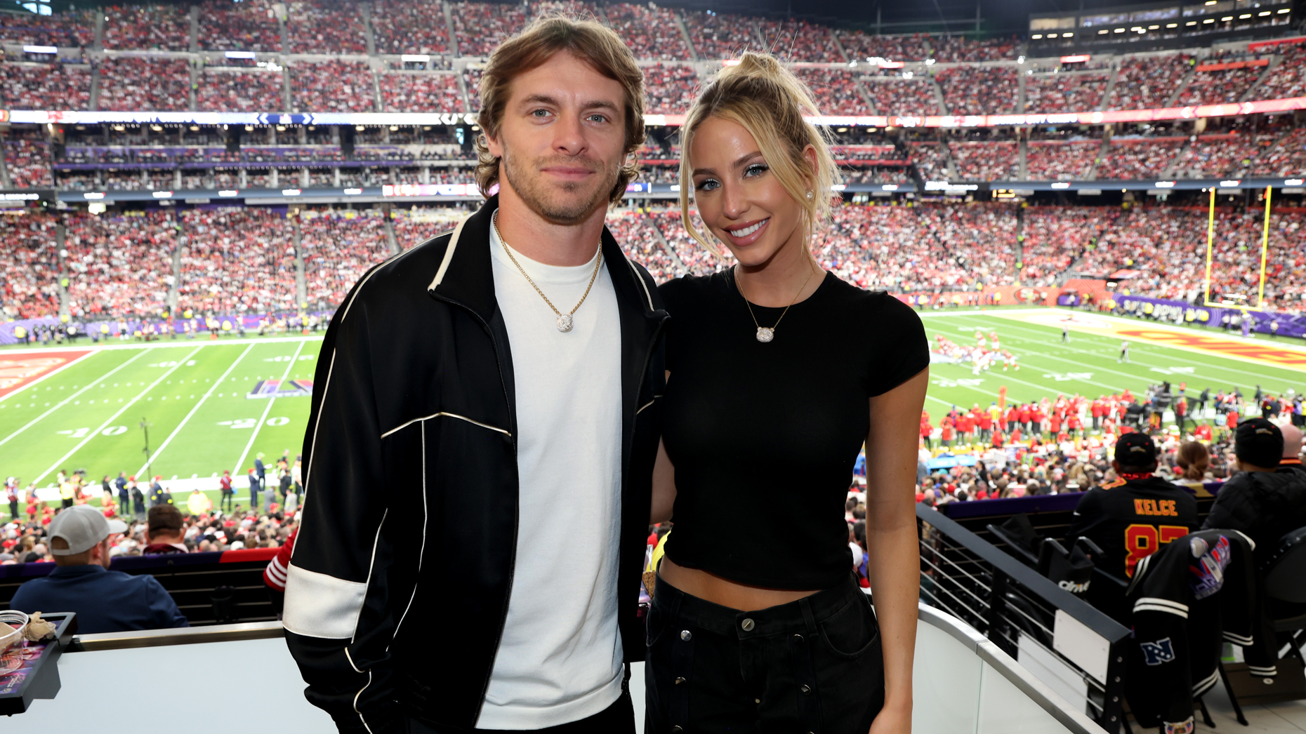 Creator Alix Earle (right) and her partner, Miami Dolphins wide receiver Braxton Barrios (left) at the 2024 Super Bowl. Photo by Getty Images.