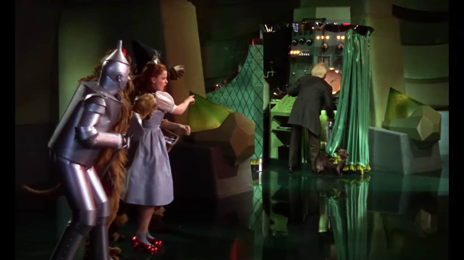 Pay no mind to the man behind the curtain. Photo via YouTube/Warner Bros. Entertainment.