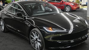 Tesla watchers expect the company to release a gussied-up Model 3 as a "low-cost" EV over the next year. Photo: Graham Hughes/Bloomberg/Getty