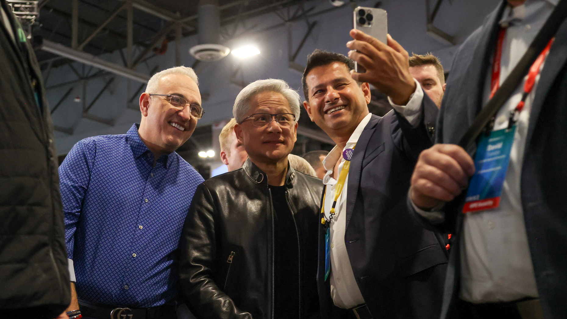 Jensen Huang, CEO of Nvidia (center), and Antonio Nero, CEO of Hewlett Packard Enterprise Co. (left), take a photo with an attendee of today's HPE Discover Event at the Sphere in Las Vegas. Photo by Ian Maule/Bloomberg via Getty Images.