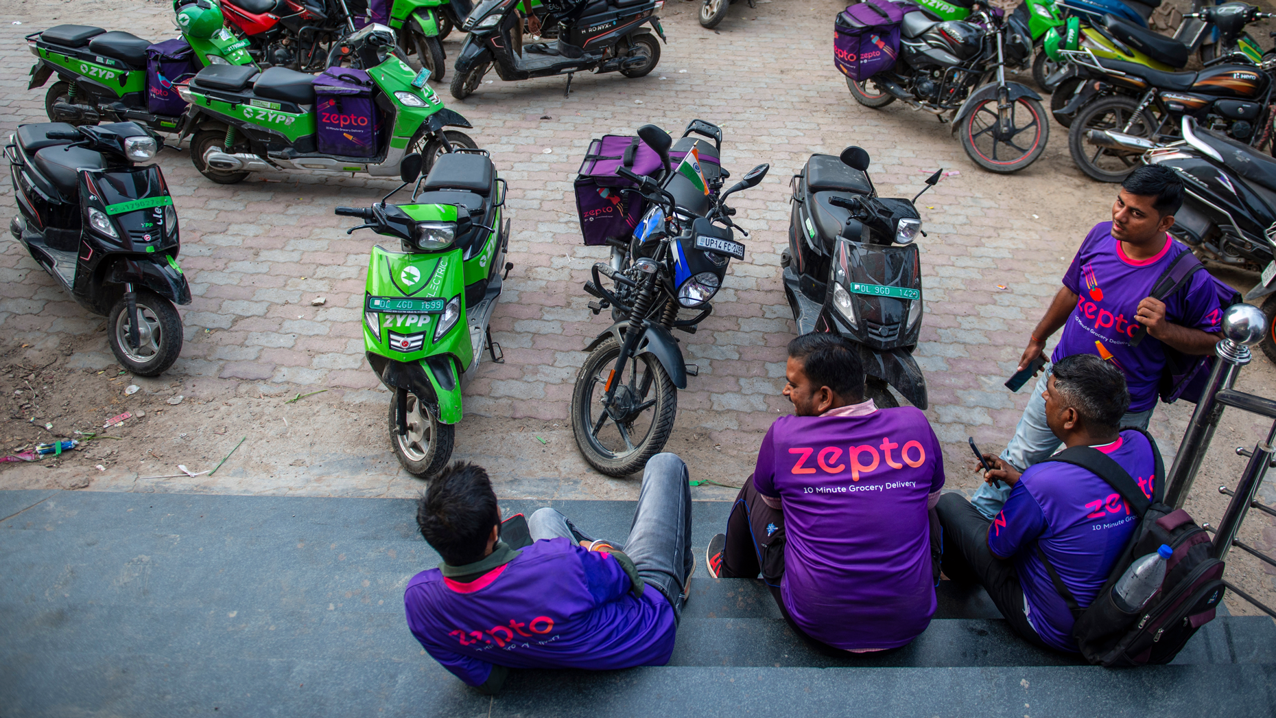 Zepto delivery drivers near New Delhi, India. Photo via Shutterstock.