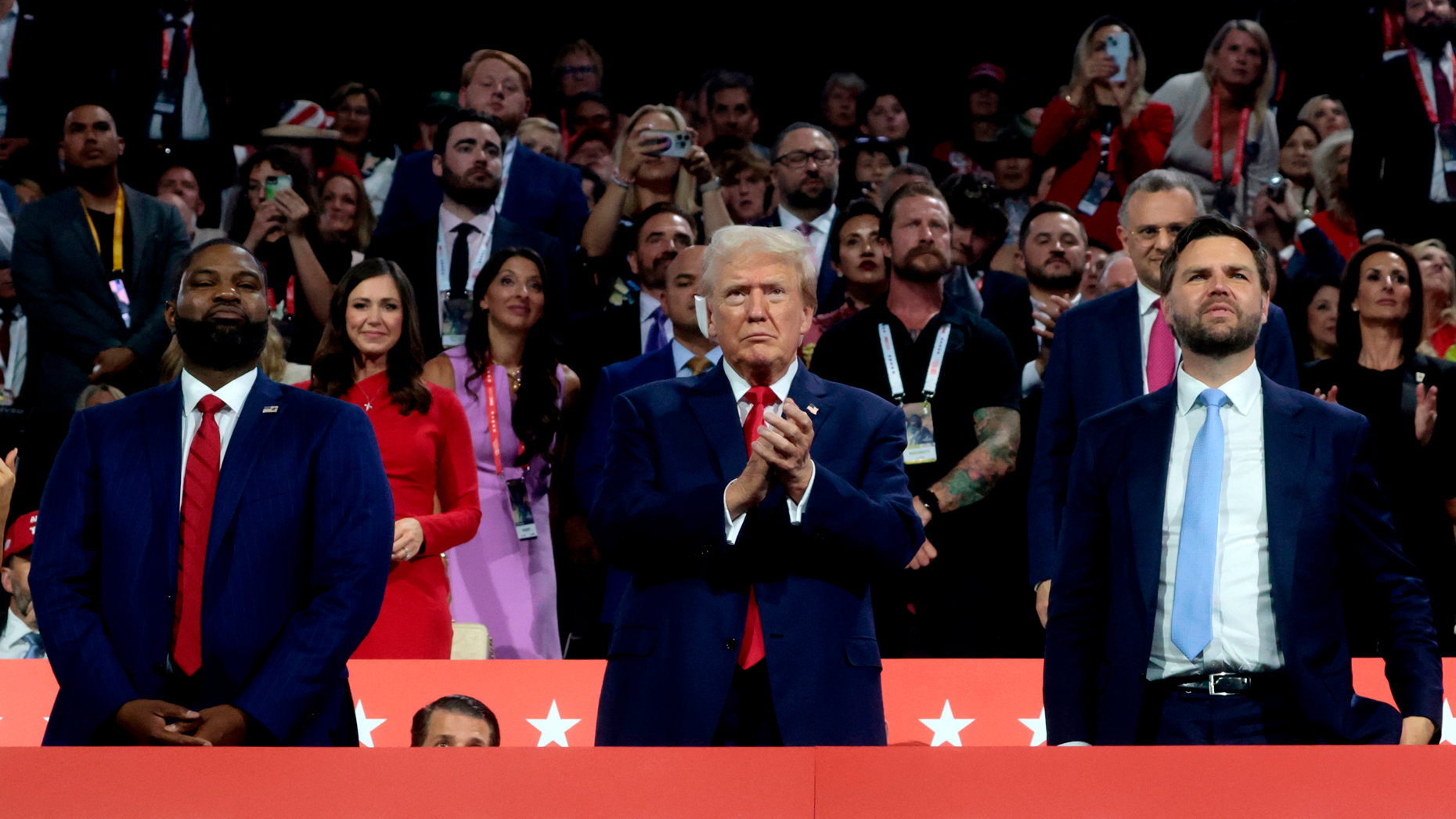 Rep. Byron Donalds (R-FL), former US President Donald Trump, and Sen. JD Vance (R-OH), Republican vice-presidential nominee, at the Republican National Convention in Milwaukee on Monday. Photo by Marie Uzcategui/Bloomberg via Getty.