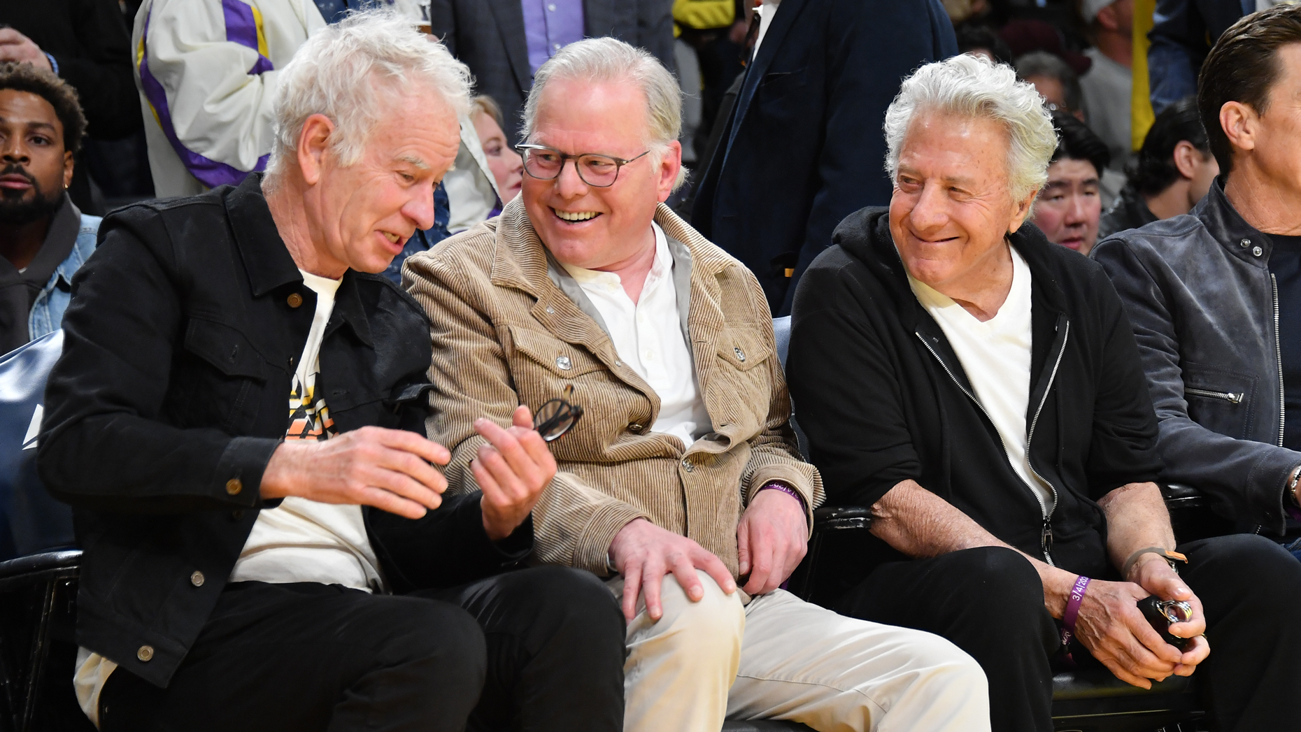 John McEnroe, David Zaslav and Dustin Hoffman at a Los Angeles Lakers game in March. Photo by Allen Berezovsky/Getty.