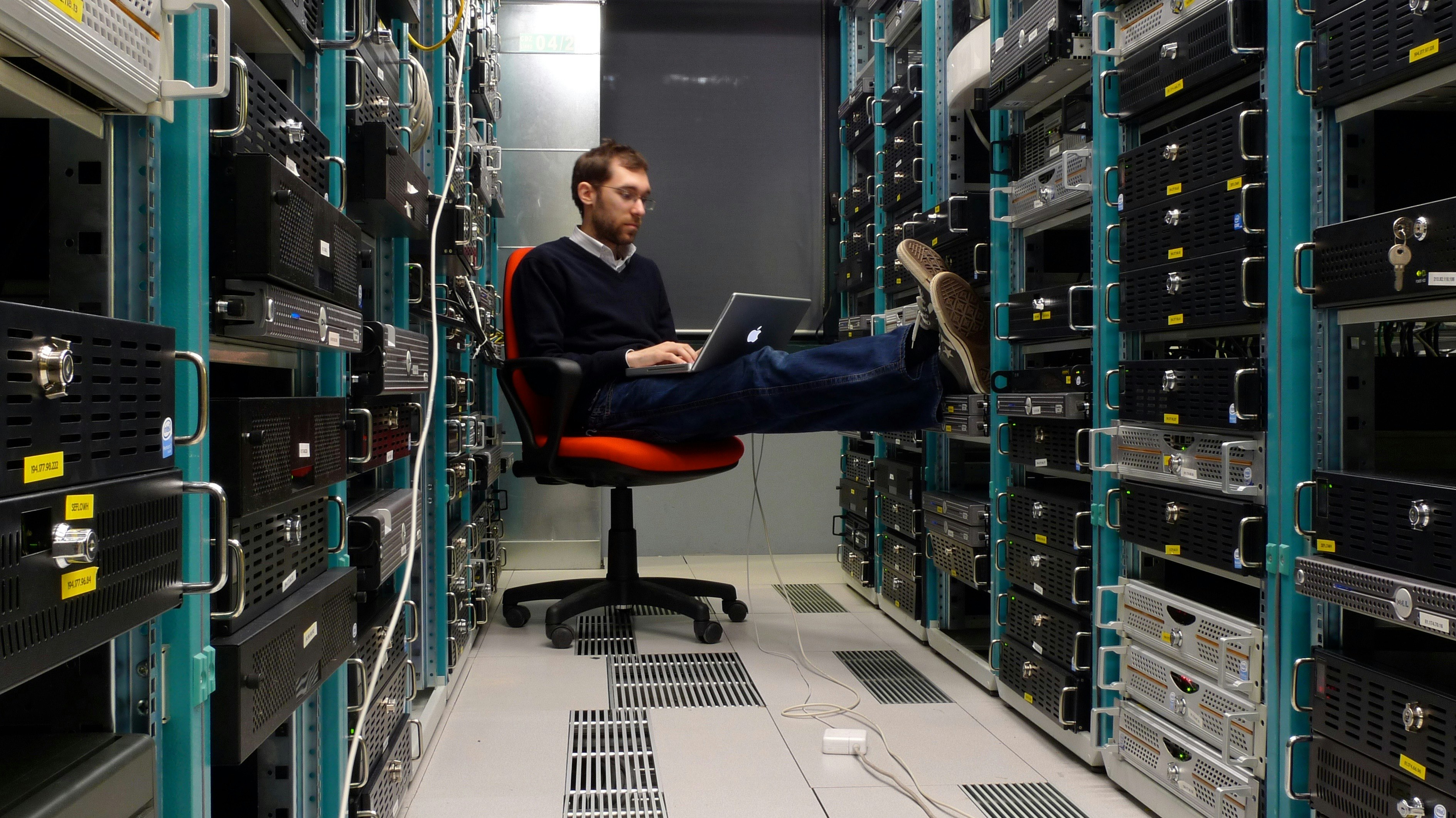 Working in a datacenter. Photo by Flickr/Leonardo Rizzi.