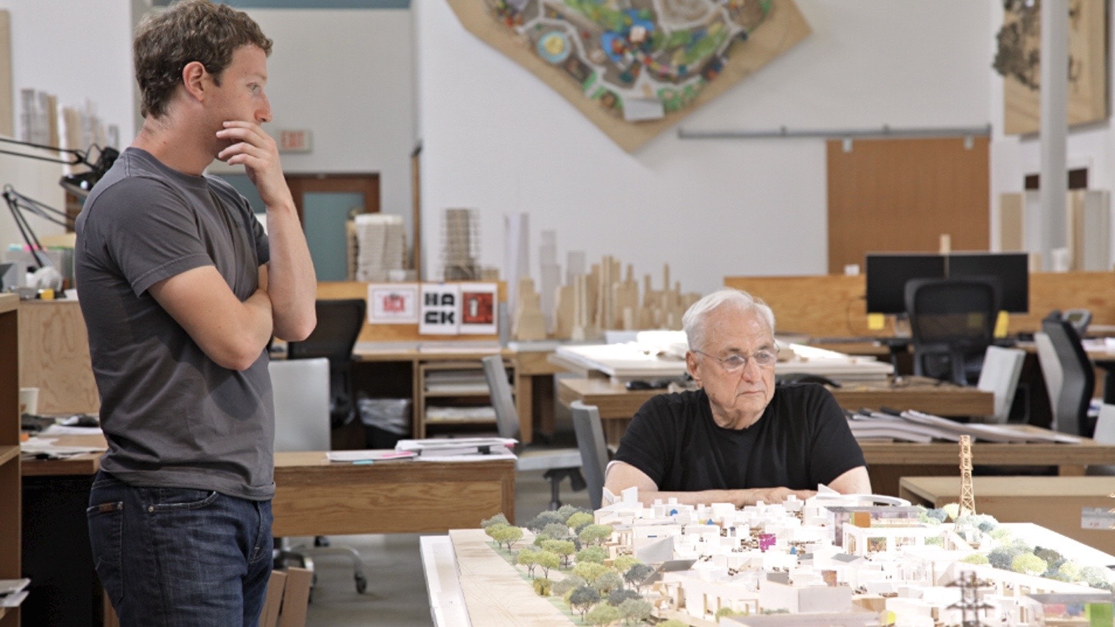 Facebook CEO Mark Zuckerberg with Frank Gehry in 2012, looking at an earlier phase of Facebook's real estate expansion plan. Photo by Flickr/Forgemind.