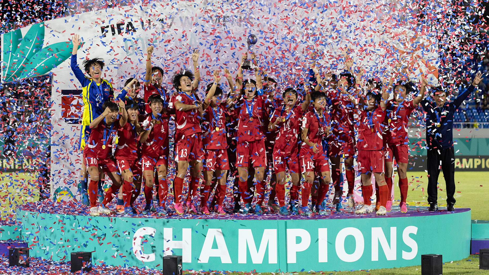 North Korea's players celebrate with the trophy after winning the FIFA U-17 women's football World Cup 2024. Photo by Getty