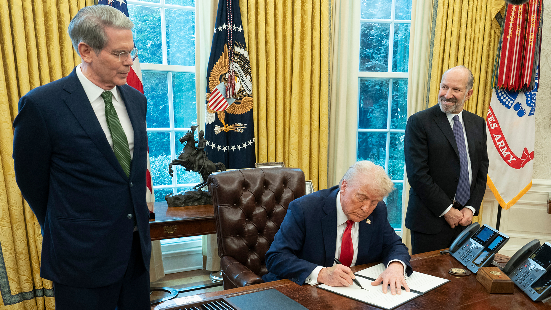 President Trump, center, signs an executive action to create a sovereign wealth fund for the U.S. Photo by Getty