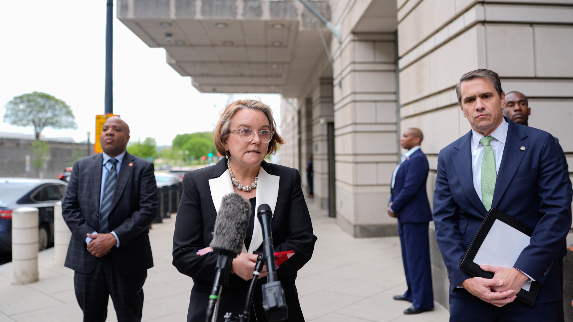 Gail Slater (center), US assistant attorney general for the Antitrust Division, and Todd Blanche (right), US deputy attorney general, today outside federal court. Photo via Getty.