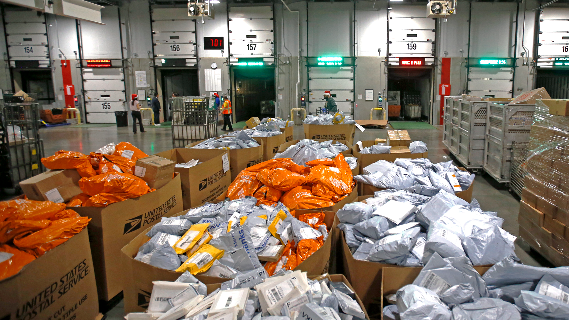 Orange Temu parcels at the United States Postal Service Los Angeles Processing and Distribution Center in Los Angeles in 2022. Photo via Getty