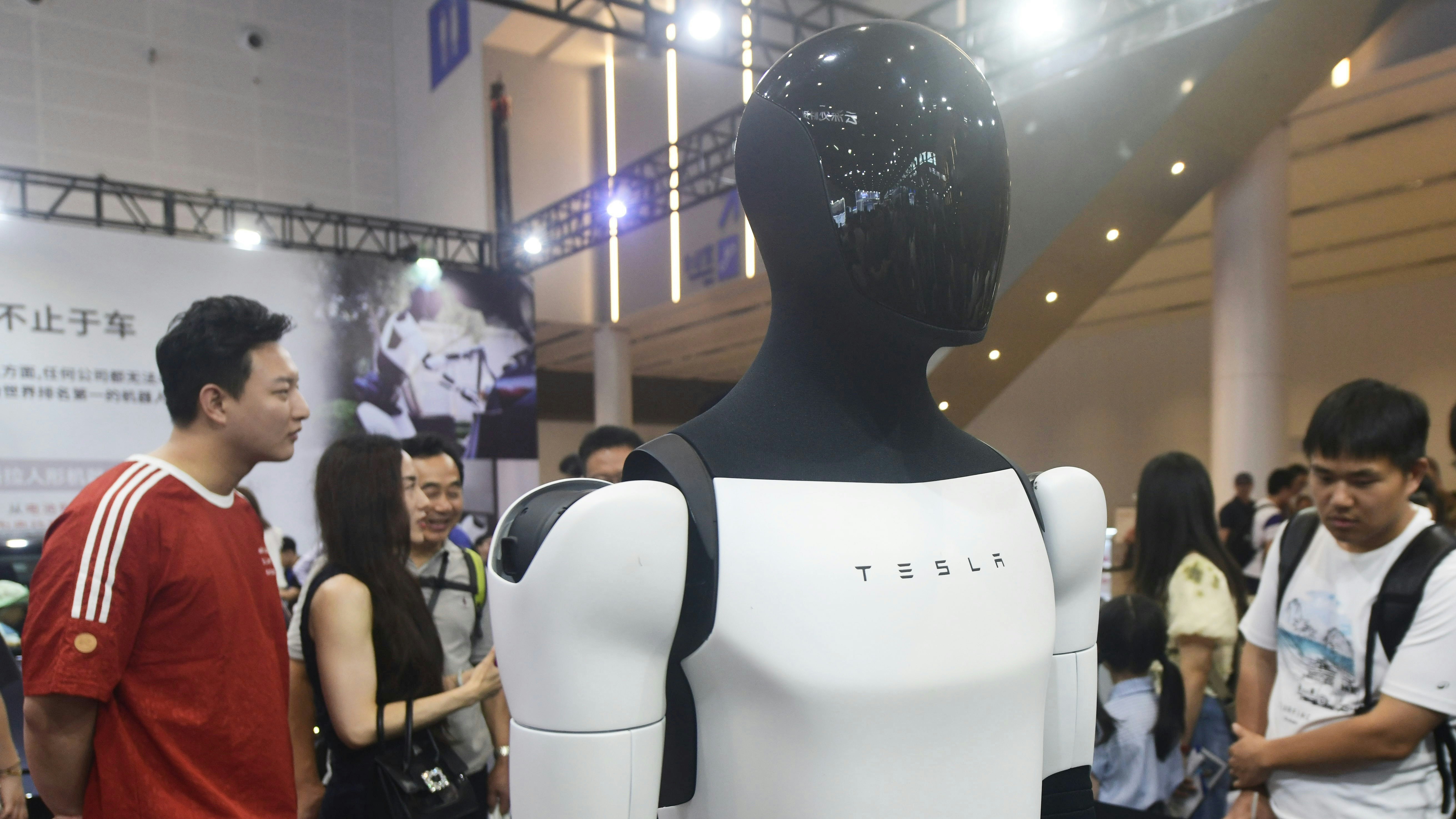 Tesla shows off its humanoid Optimus at an exhibition in Hangzhou, China. Photo: Costfoto/NurPhoto/Getty 