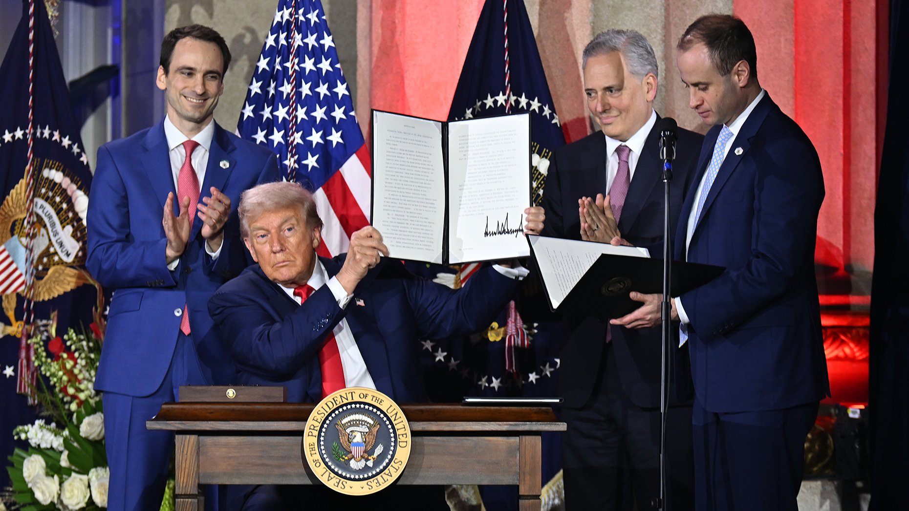 From left: Michael Kratsios, Donald Trump and David O. Sacks onstage at the All‑In Podcast and the Hill & Valley Forum on July 23. Photo by Getty