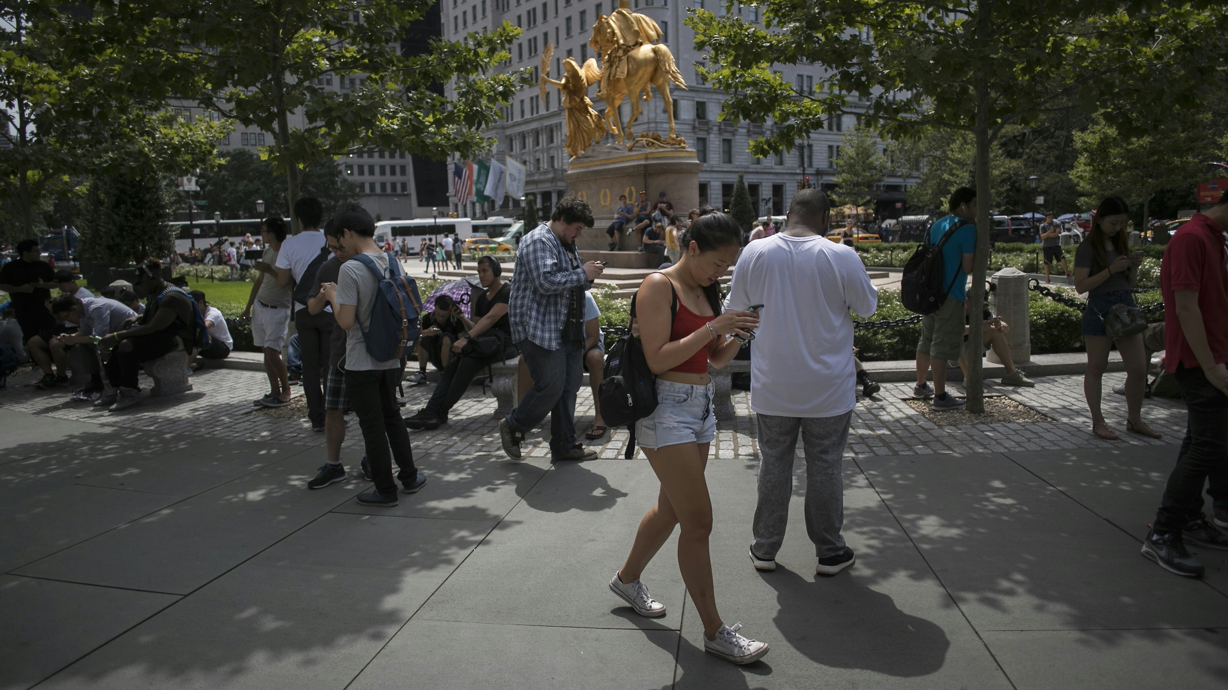 People playing Pokemon Go in New York City this week. Photo by Bloomberg.