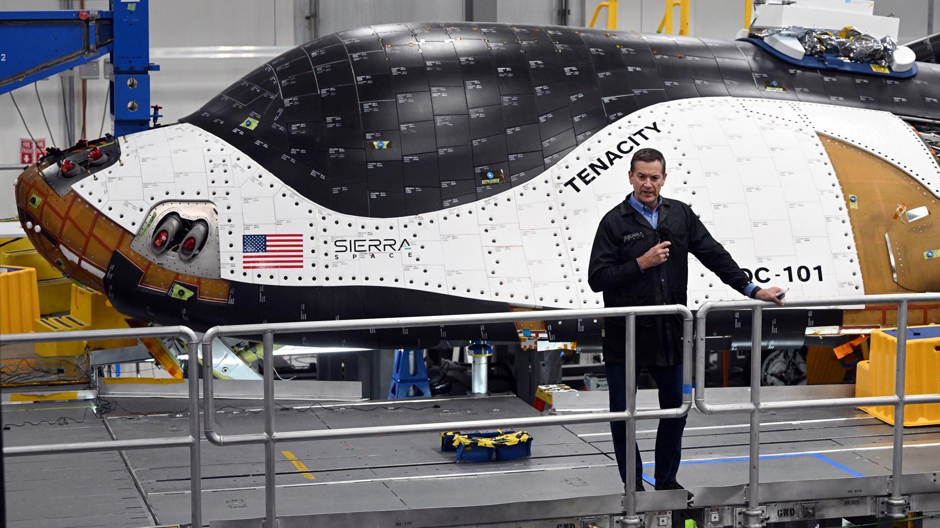 Tom Vice, the former CEO of Sierra Space, speaks in front of the company's  Dream Chaser space plane in 2023. Getty Images