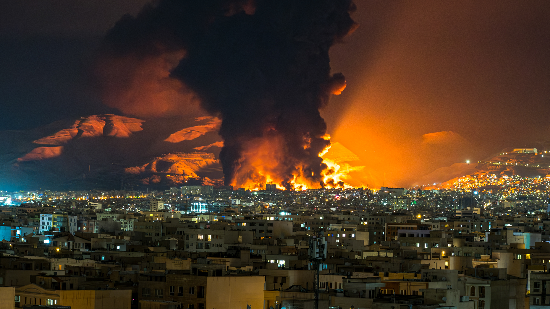 Airstrikes on an oil depot in Tehran on March 7. Sasan/Middle East Images/AFP via Getty Images.