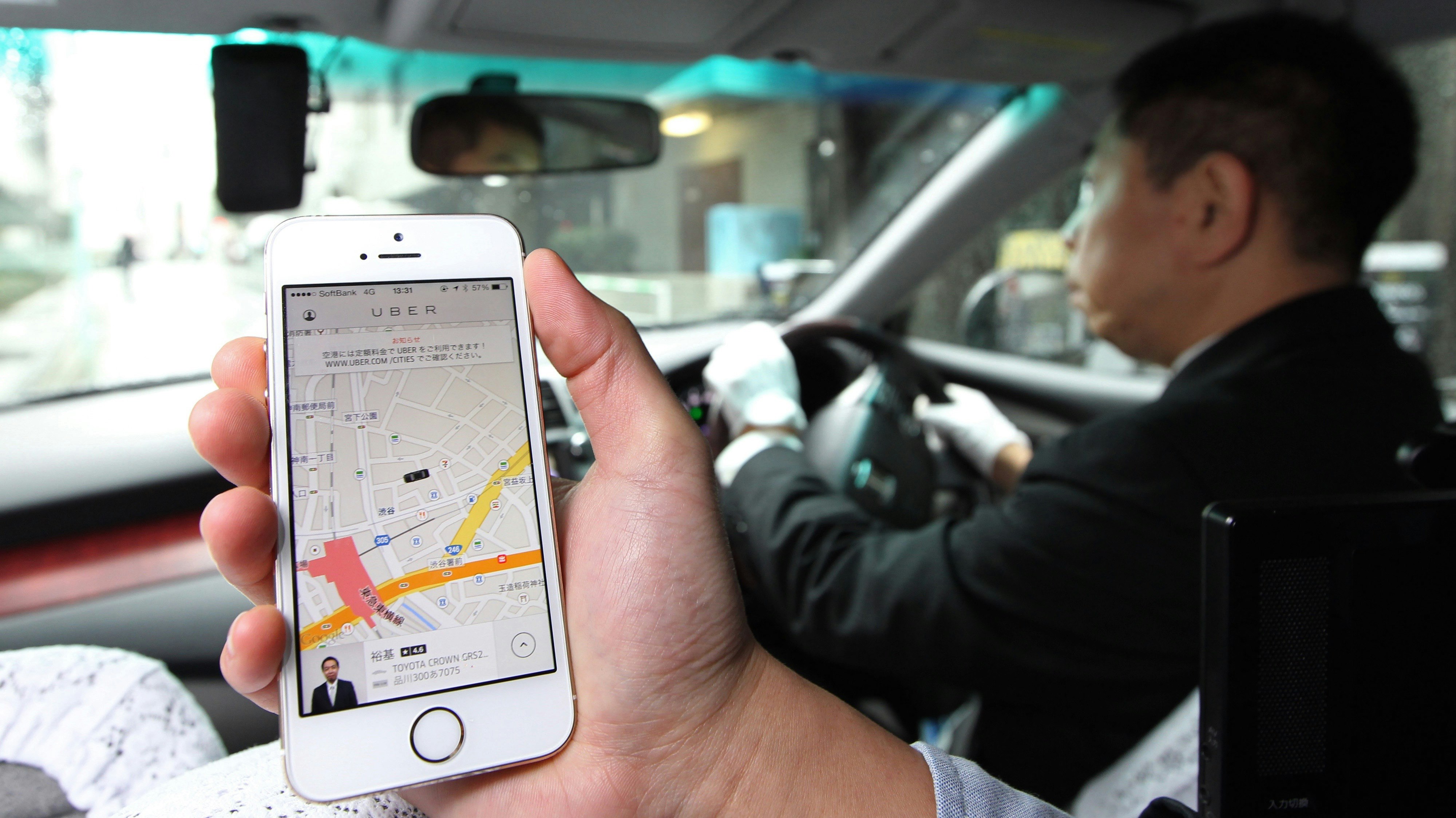 Uber's app open in Japan. Photo by Bloomberg. 