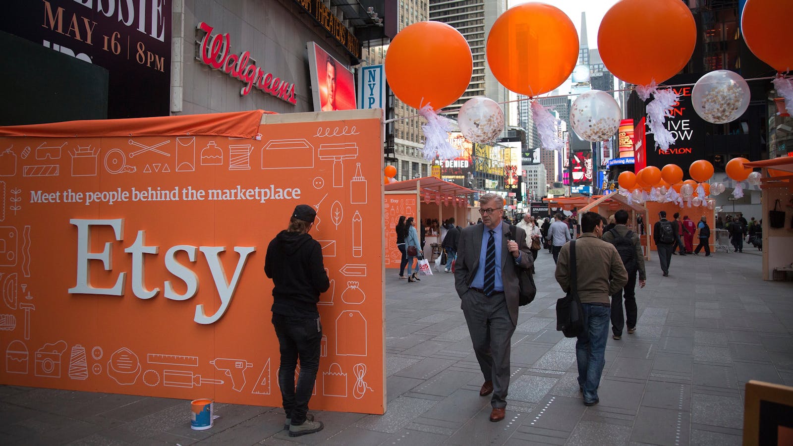 Merchants who use Etsy display their wares outside the Nasdaq MarketSite in New York the day Etsy went public last year. Photo by Bloomberg.