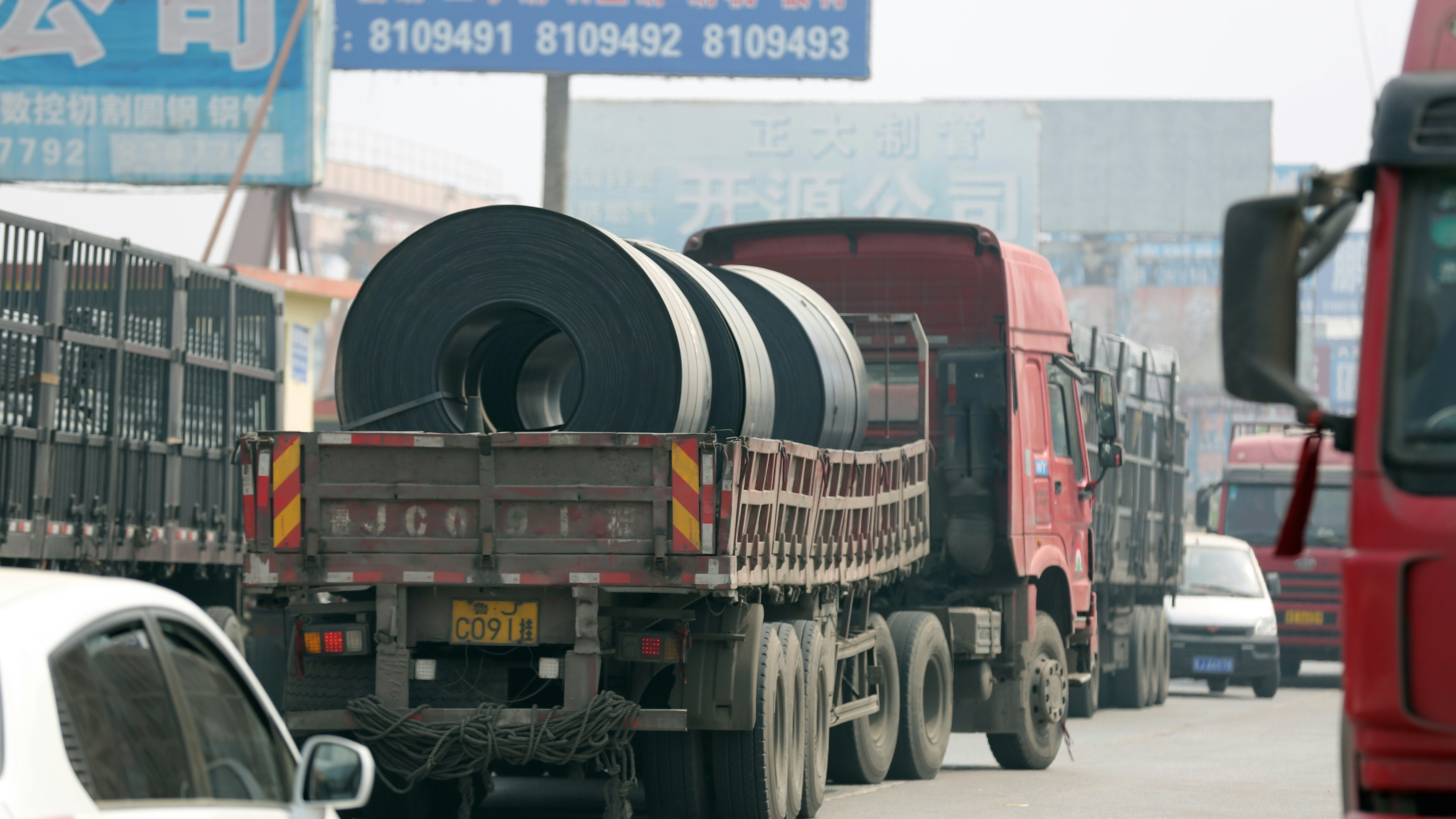 A truck carrying steel in China. Photo by AP.
