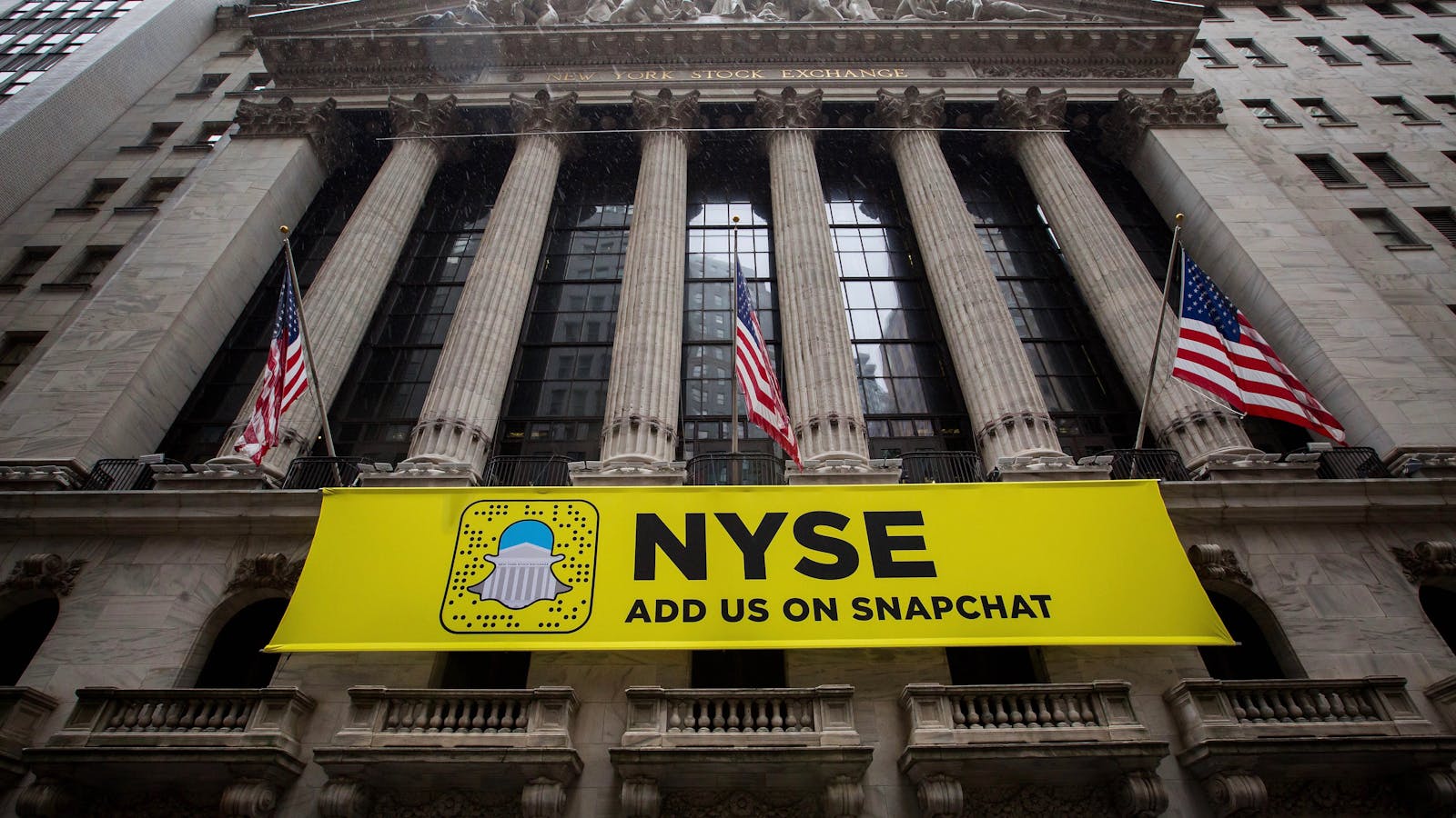 A Snap banner at the New York Stock Exchange. Photo by Bloomberg.