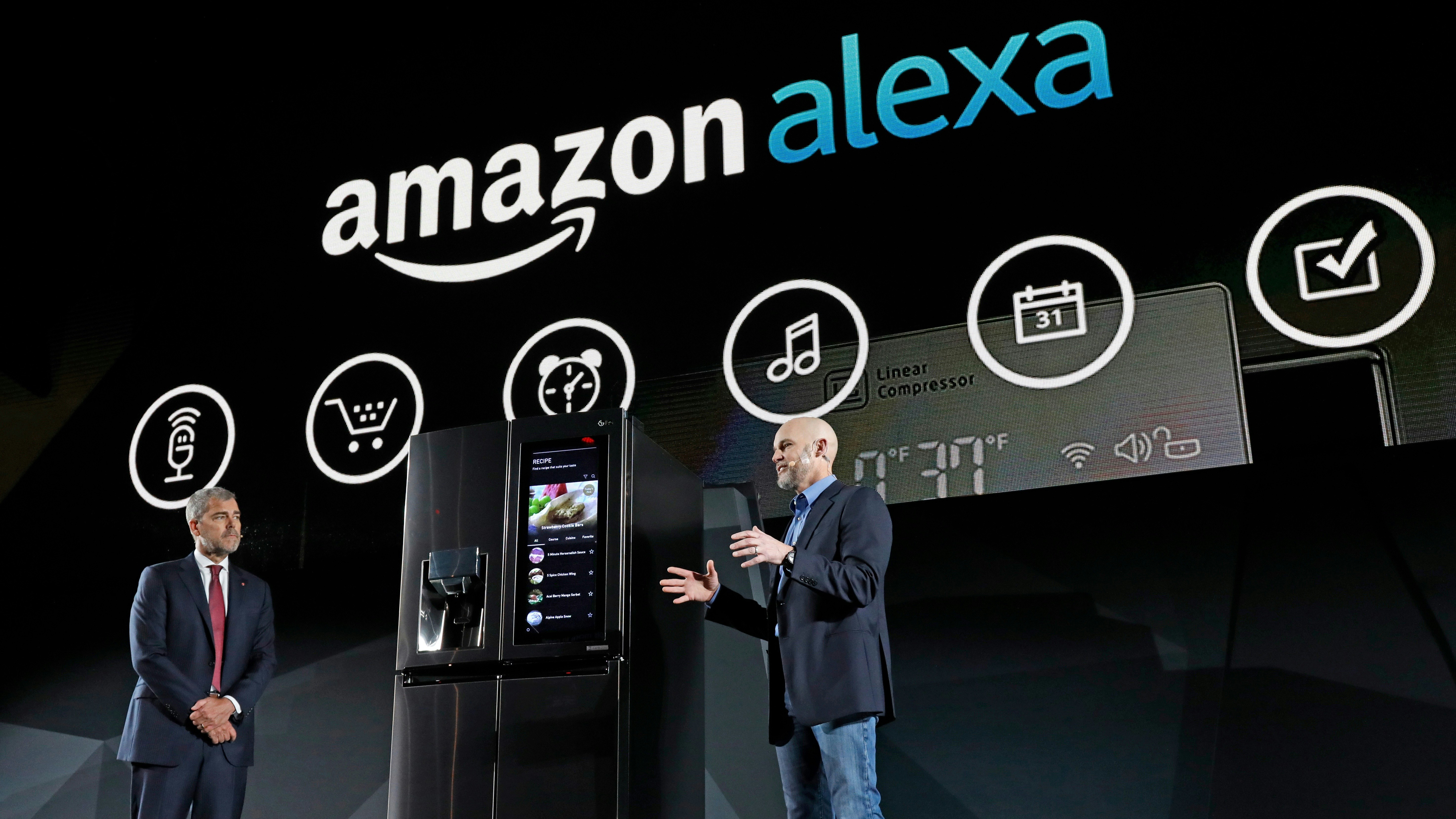 LG Electronics’ vice president David VanderWaal and Amazon Echo vice president Mike George unveiling an LG fridge equipped with Amazon Alexa at CES in January. Photo by AP