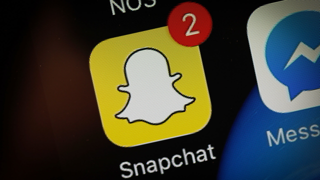 Snapchat app is seen on an iPhone. Photo by AP