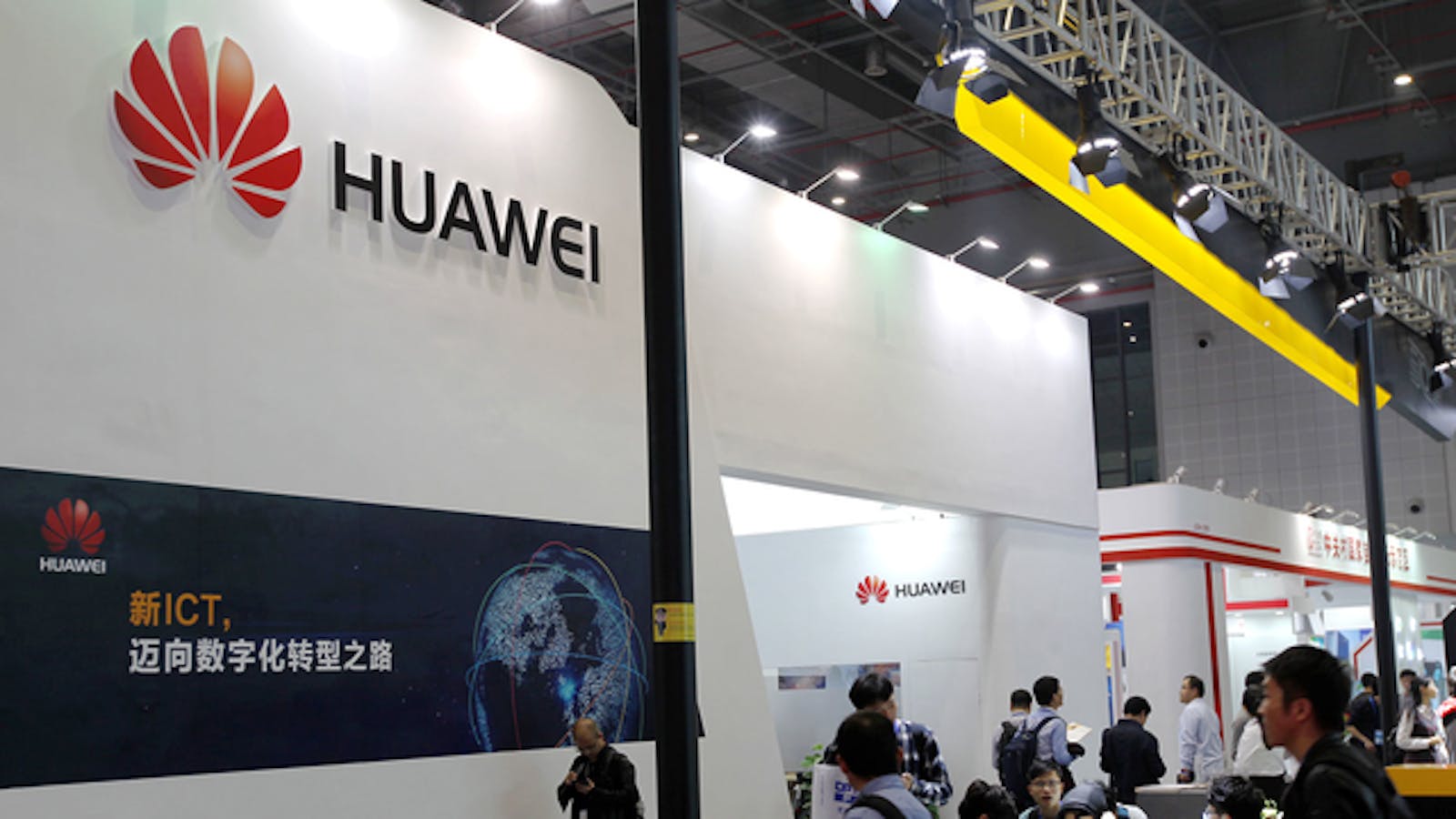 People visit Huawei's stand during an exhibition in Shanghai in late November.  Photo by AP