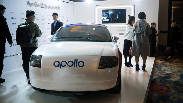 The branding for Baidu's Apollo self-driving car system is displayed on a car at the Baidu World Technology Conference in Beijing, China. Photo by Bloomberg.