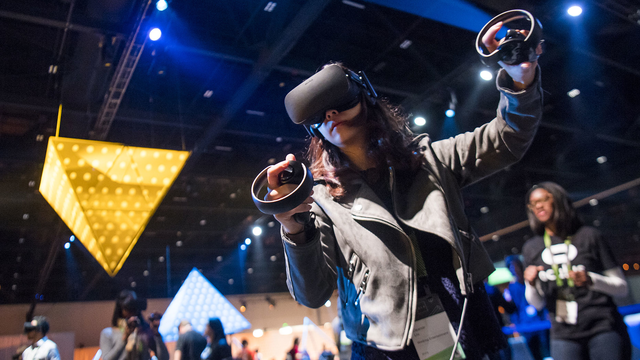An attendee using the Oculus Rift VR headset at an event last October. Photo by Bloomberg.