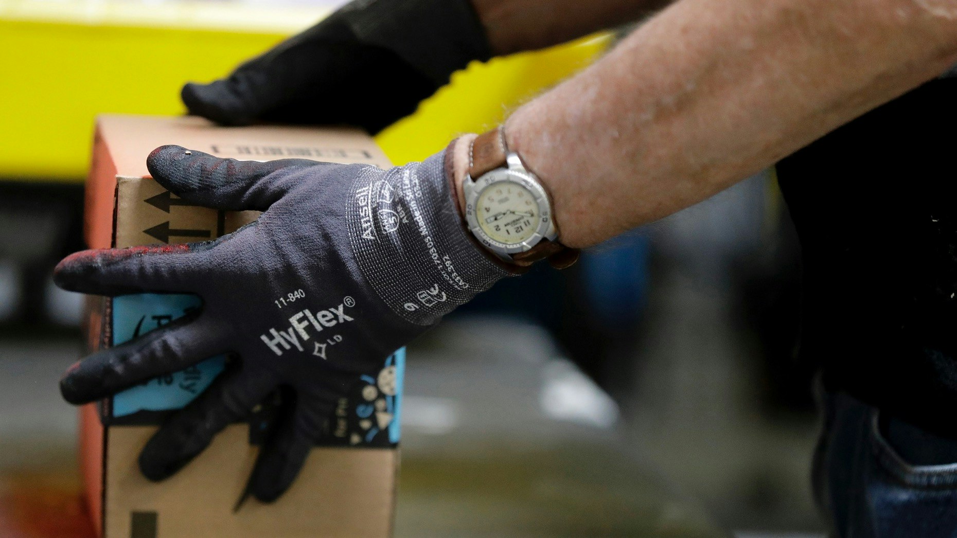 An employee packages a product at the Amazon Fulfillment center in Robbinsville Township, N.J. Photo: AP 