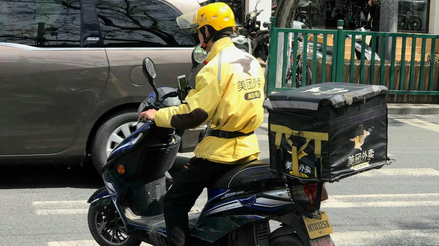 A Meituan food delivery courier in Beijing. Photo: AP