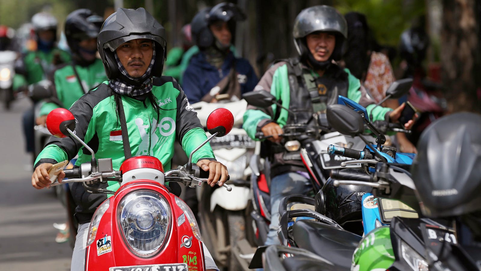 GoJek motorbike riders in Djakarta. Photo by AP
