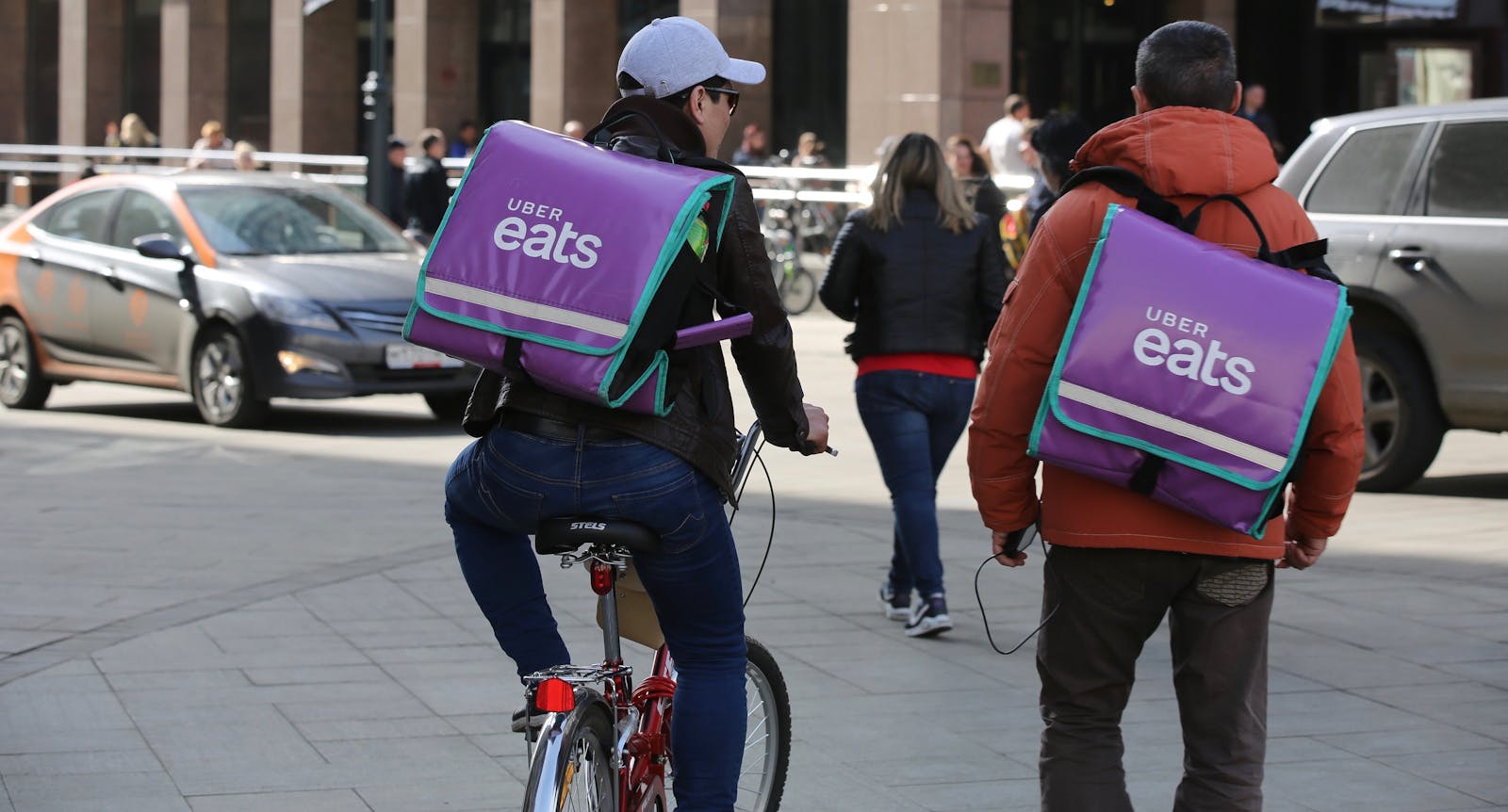 Uber Eats delivery people in Moscow. Photo by Bloomberg