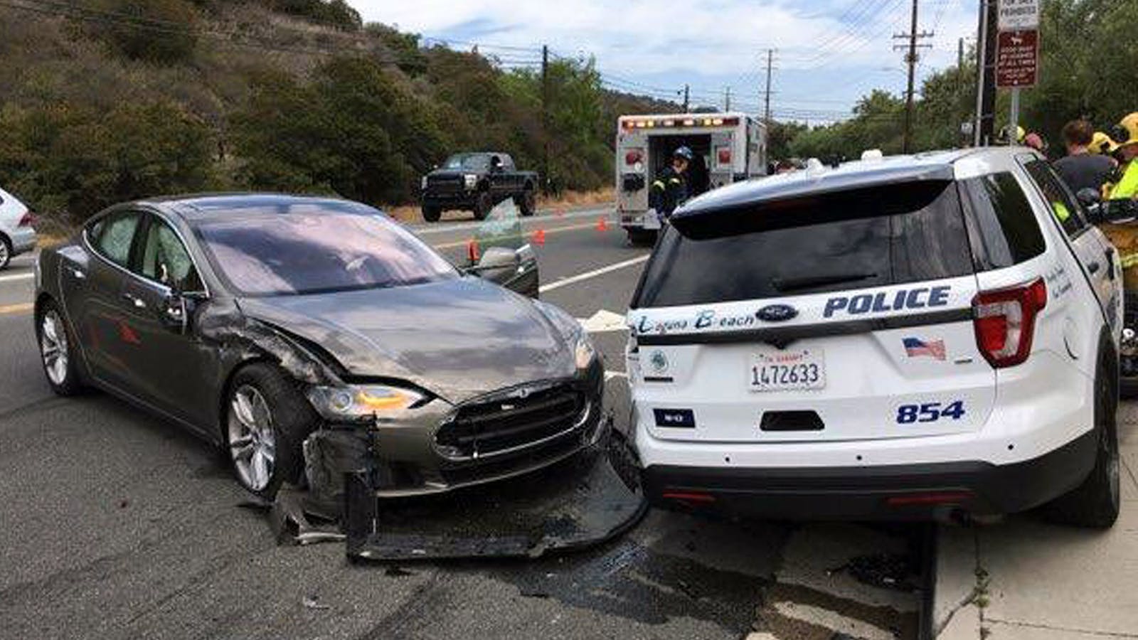 A Tesla sedan, left, in autopilot mode that crashed into a parked police cruiser in Laguna Beach, Calif., in May. Photo: AP