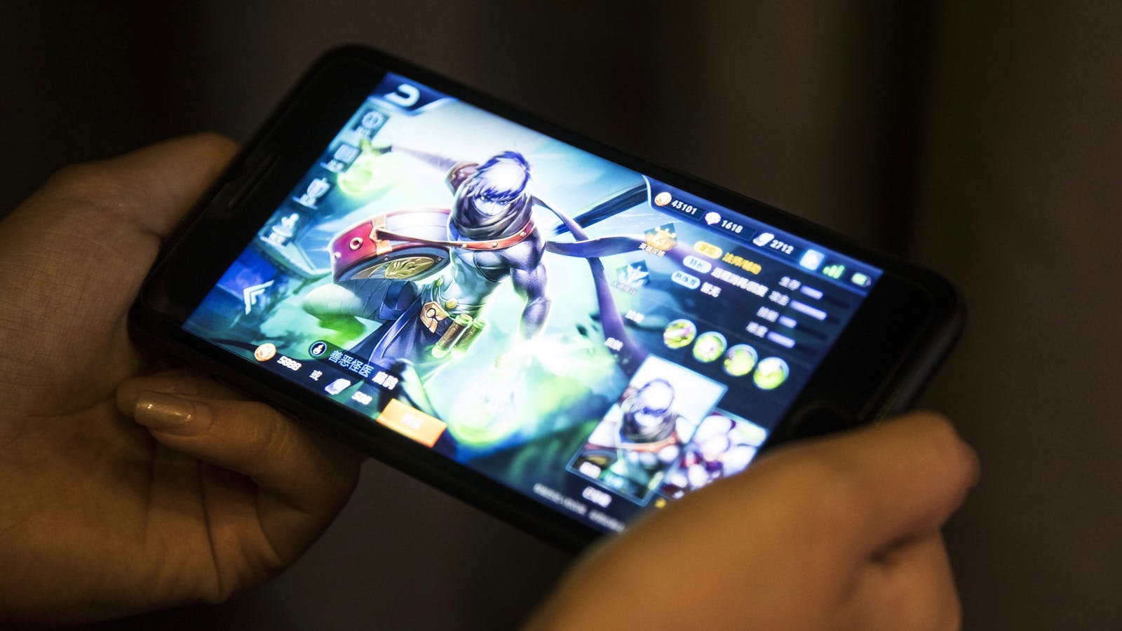 Tencent's Honor of Kings mobile game on an iPhone in Hong Kong last year. Photo by Bloomberg