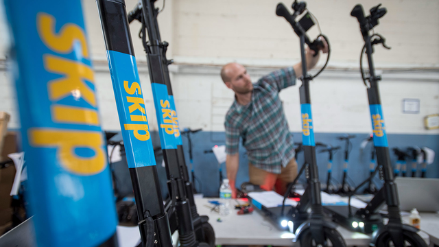 A technician worked on a Skip scooter at the company's repair shop in San Francisco. Photo: Bloomberg