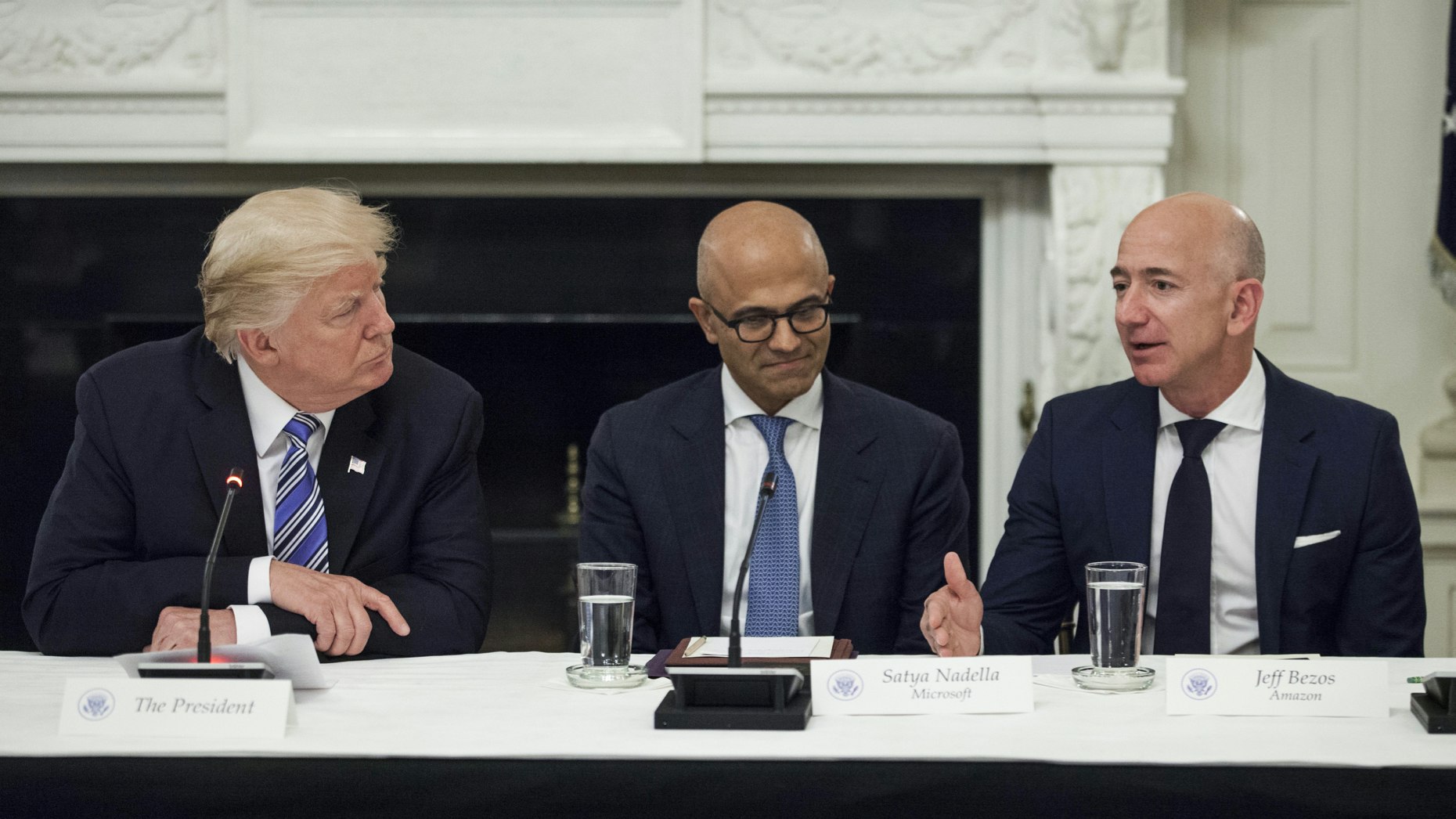 President Donald Trump, Microsoft CEO Satya Nadella and Amazon CEO Jeff Bezos at a White House event last year. Photo by Bloomberg