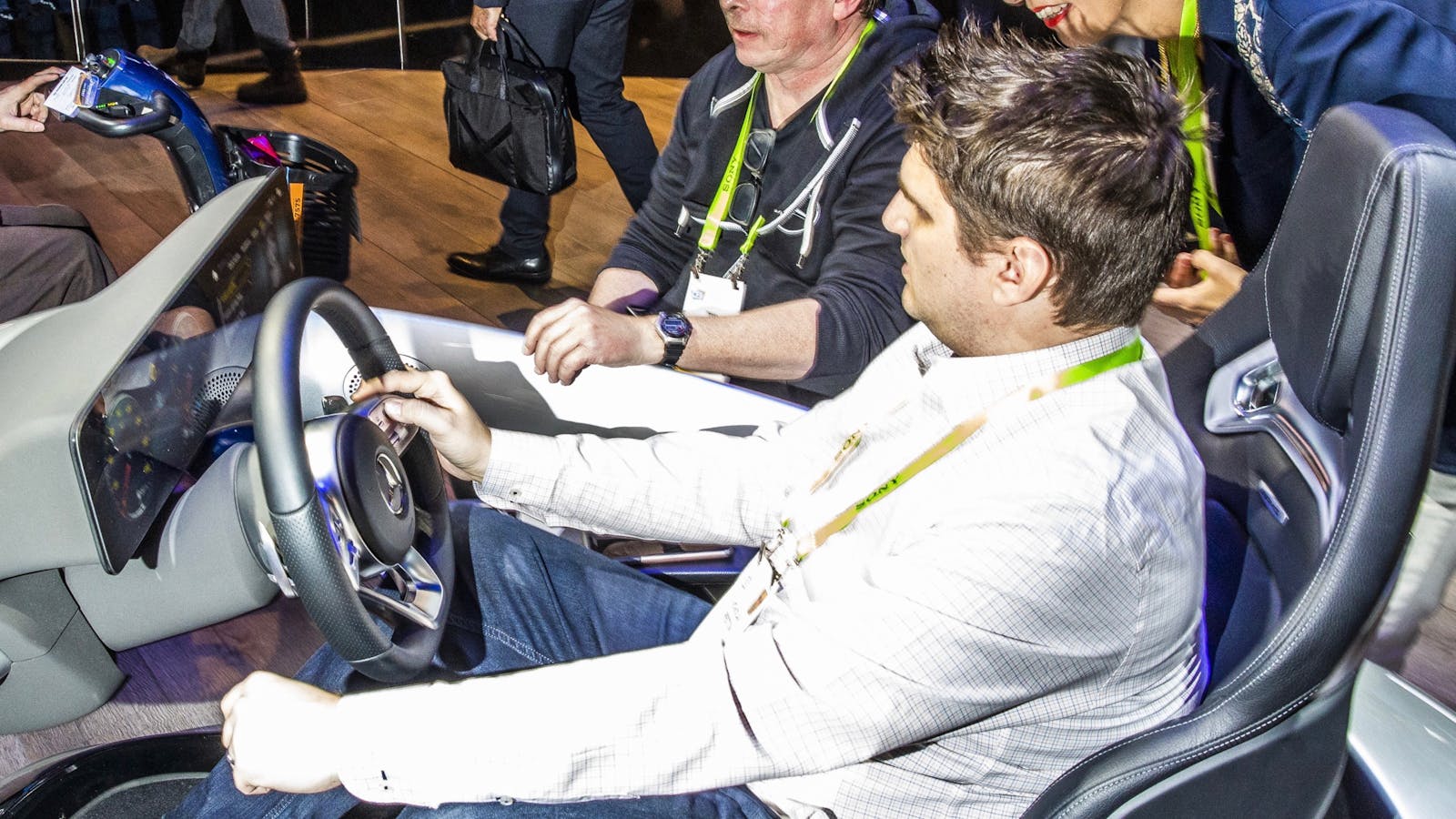 An attendee trying out the Mercedes Benz multimedia system at CES this week. Photo by Bloomberg