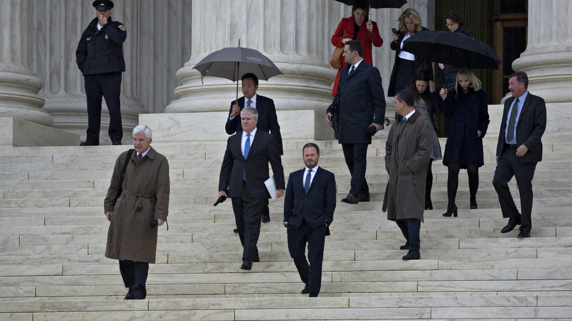 Daniel Wall, a lawyer for Apple in the Apple v. Pepper case, left, leaves the U.S. Supreme Court last November. Photo by Bloomberg
