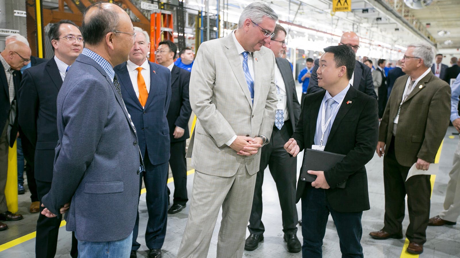 Indiana governor Eric Holcomb with SF Motors founder John Zhang touring Seres' Indiana factory in May of last year. Photo by AP
