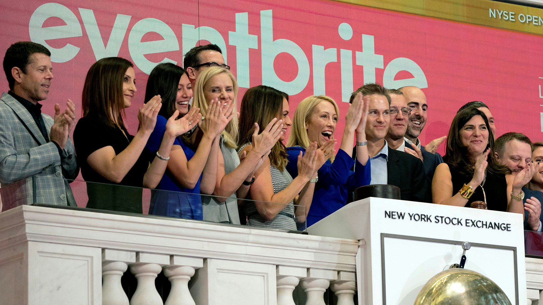 Eventbrite CEO Julia Hartz, center, and Kevin Hartz, right center, her husband and company chairman, celebrate as she rings the New York Stock Exchange opening bell, Thursday, Sept. 20, 2018, to mark the company's IPO. Photo by AP.