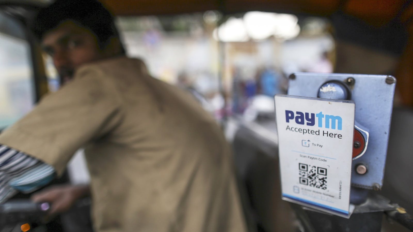 A driver in Bengaluru, India, who accepts Paytm. Photo by Bloomberg.