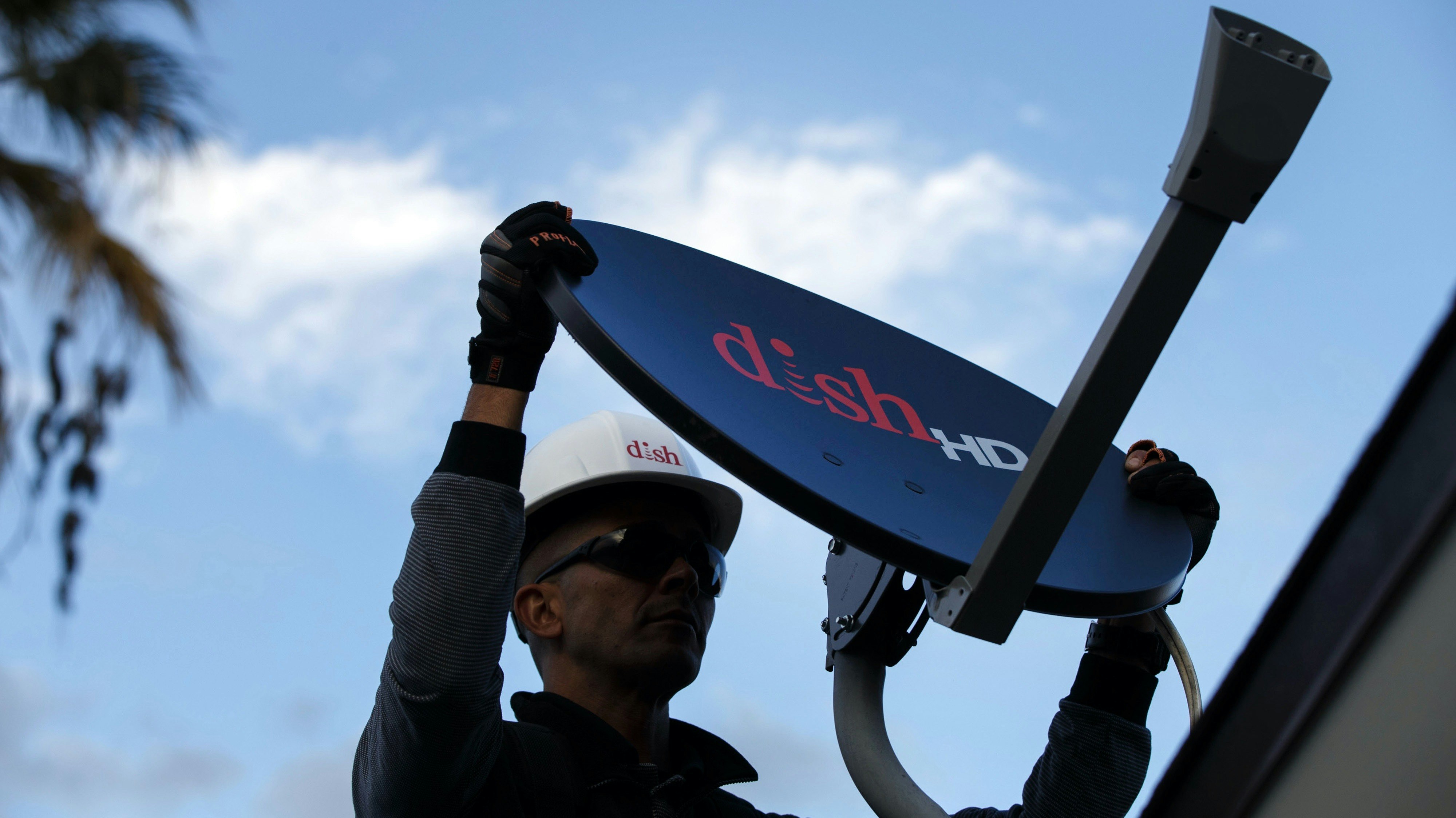 A technician working for Dish Network, which has begun offering marketing and customer support to other TV providers. Photo by Bloomberg
