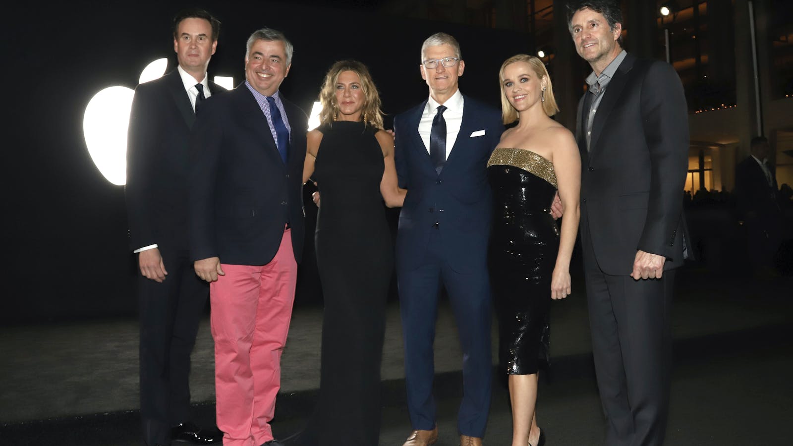 Apple's Zack Van Amburg, Eddy Cue (in red pants) with Jennifer Aniston, Apple CEO Tim Cook, Reese Witherspoon and Apple's Jamie Erlicht
at the "The Morning Show" premiere in New York. Photo by AP